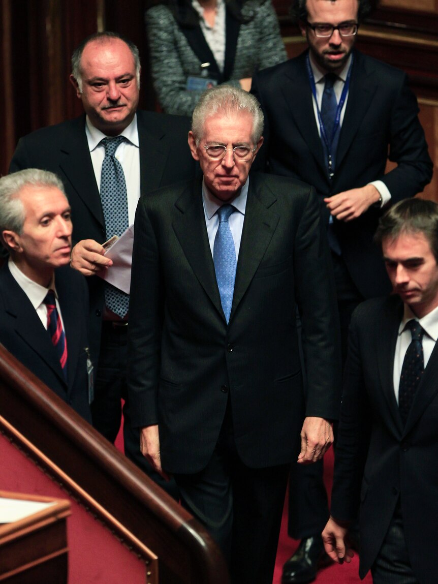 Former European Commissioner Mario Monti (C) arrives at the senate in Rome