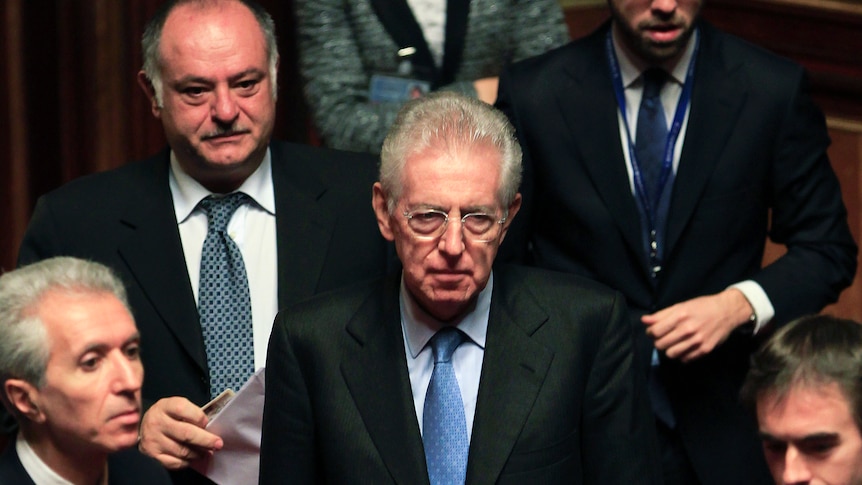 Former European Commissioner Mario Monti (C) arrives at the senate in Rome