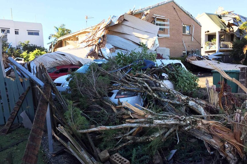 A car wrecked by roof debris