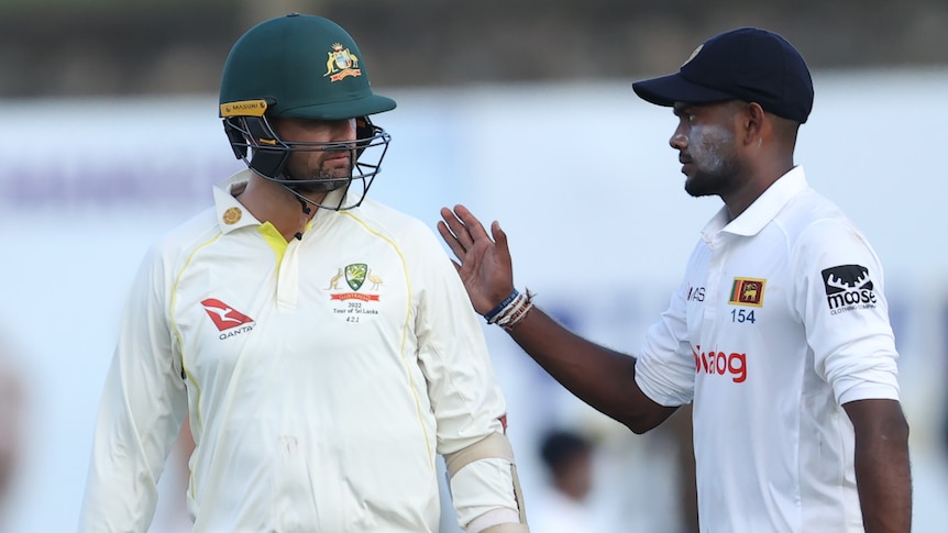 An Australian male cricketer and a Sri Lankan counterpart have a conversation in Galle.