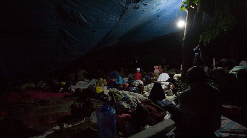 People sleep on a square in Port-au-Prince's Petionville district