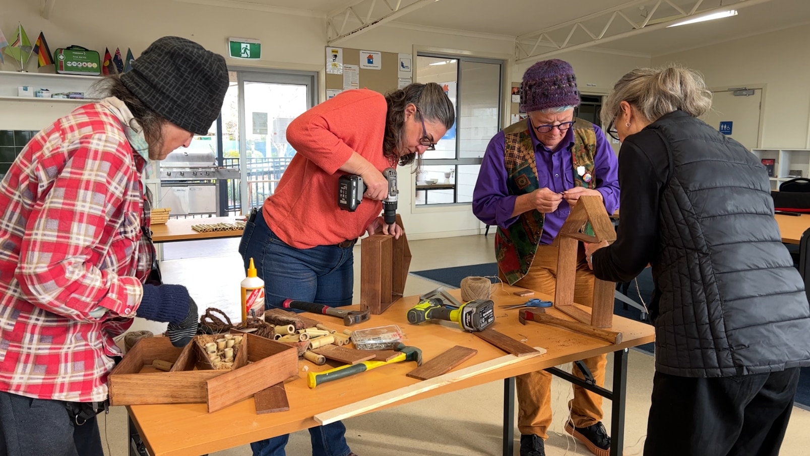 Elderly women living alone learn how to use power tools to remain
