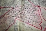 Historical map of Perth with areas marked in red.