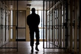 A warden patrols in the corridors of the Bois d'Arcy jail on July 8, 2014, near Paris.