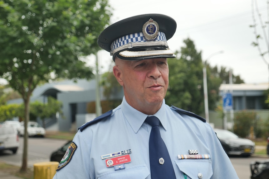 police officer speaks with the press