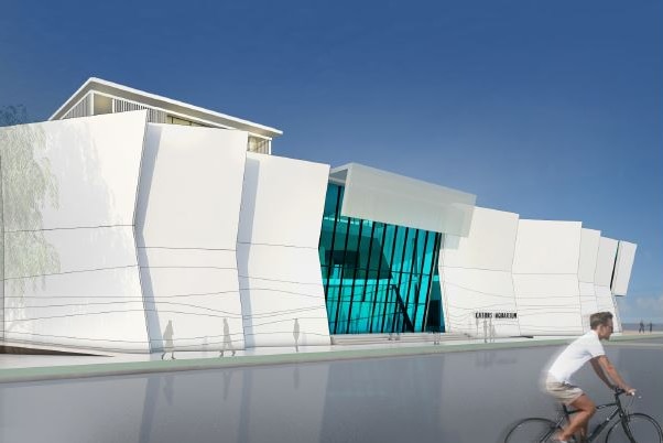 A concept drawing of the Cairns Aquarium shows a large white building with a glass facade.