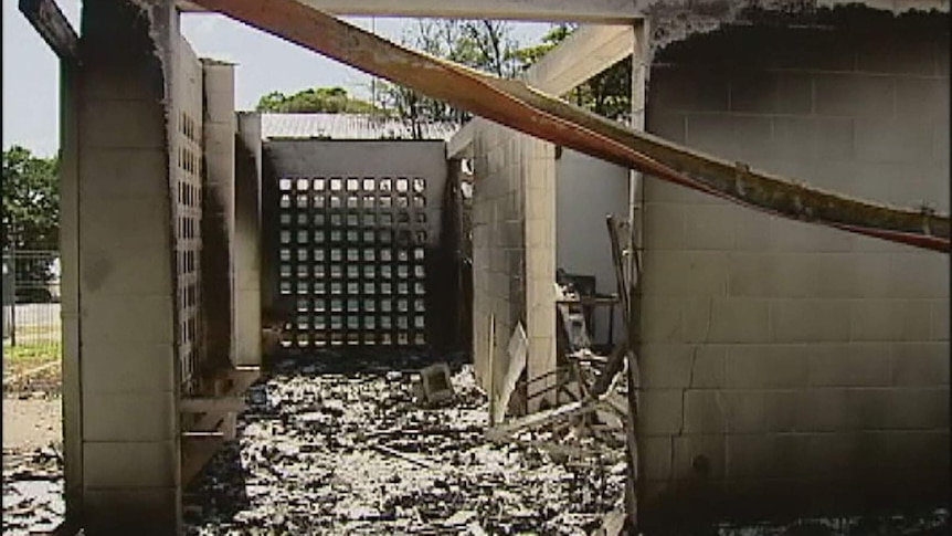 The burnt-out Palm Island police station after the riot