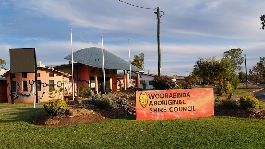 Woorabinda Aboriginal Shire Council sign in front of a colourful building