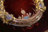 Crown of Thorns is displayed at Notre Dame Cathedral. It is in a circular ornate case made of crystal and gold.