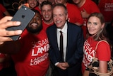 Bill Shorten joins Labor supporters for a selfie at an election after party