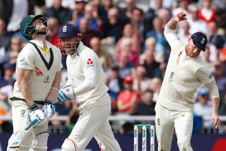 Australia batsman Steve Smith throws his back as Jonny bairstow shouts and Ben Stokes prepares to throw the ball into the ground