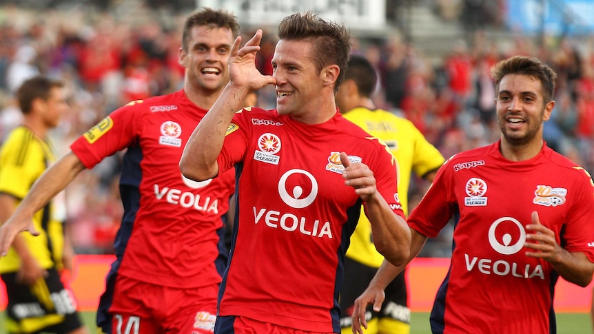 Adelaide United's Jeronimo Neumann celebrates his goal against the Phoenix