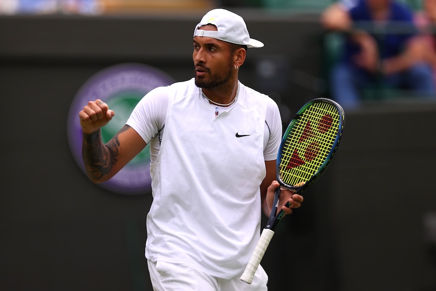 Nick Kyrgios pumps his fist.