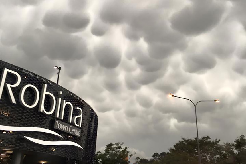 Ominous storm clouds roll over a shopping mall.