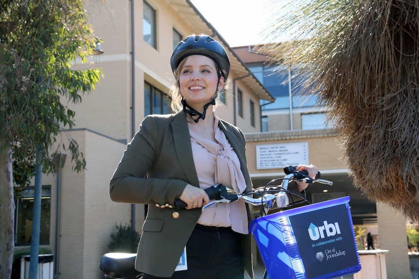 Sarah Robinson with an Urbi bike on the health campus.