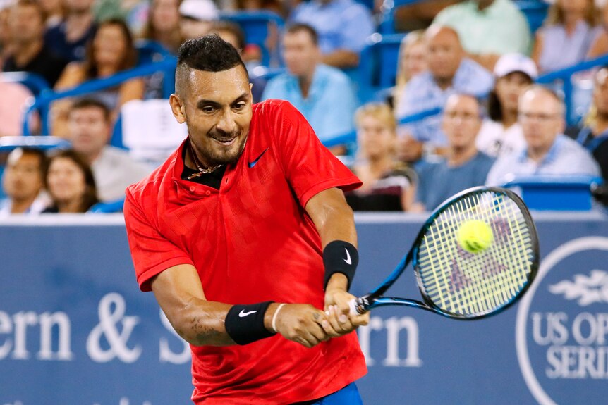 Nick Kyrgios plays a backhand at Cincinnati Masters