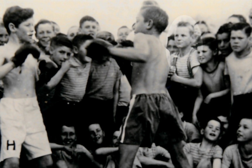 Paddy Cannon watching two boys boxing at Clontarf Boys Town