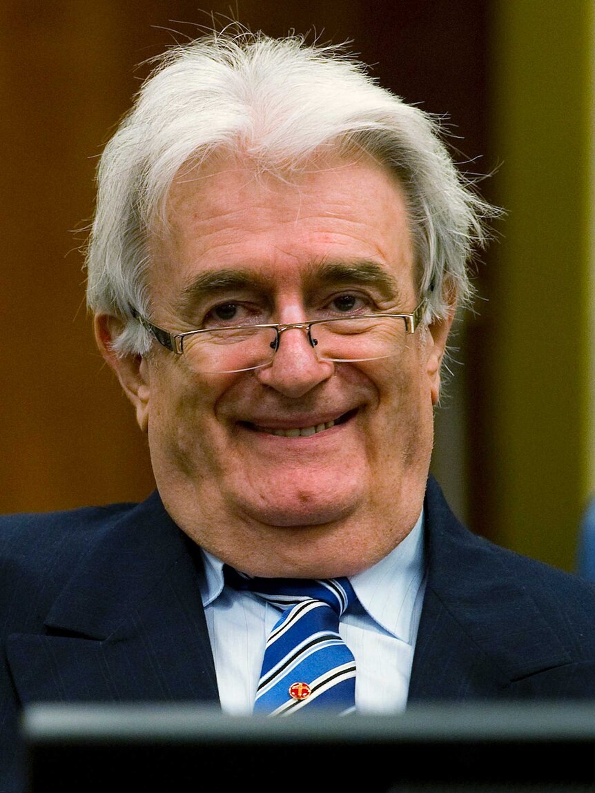 Radovan Karadzic smiles in court
