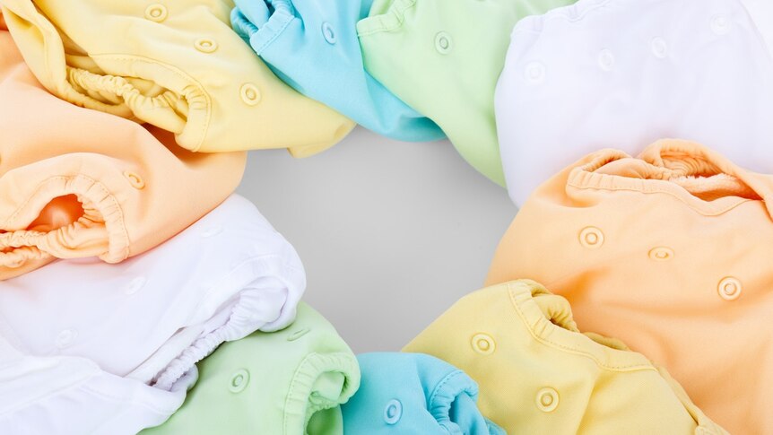 Several cloth nappies in different colours for story on being sustainable with small children