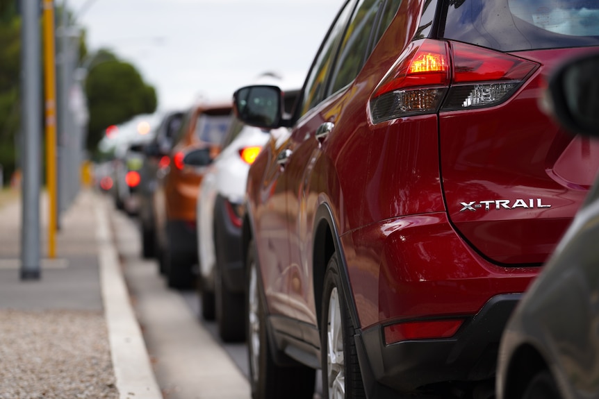 A queue of cars for rapid antigen tests.