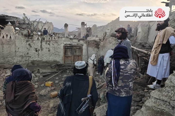 An image provided by Afghanistan state news agency showing residents surveying the damage from the earthquake. 