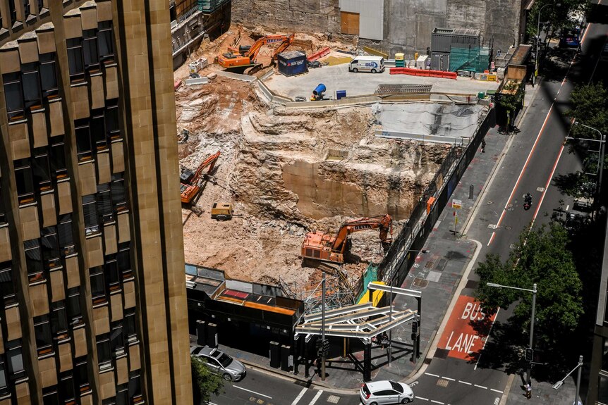 A birdseye view of diggers in a construction zone