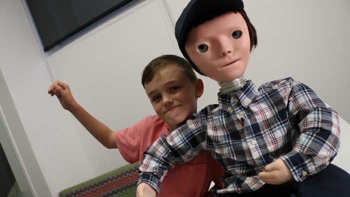 Boy with human looking robot