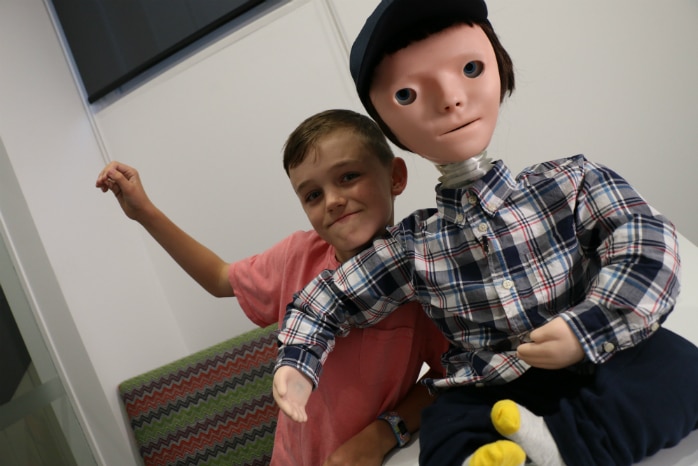 Boy with human looking robot
