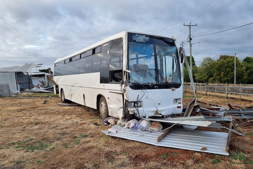 A bus with a smashed window