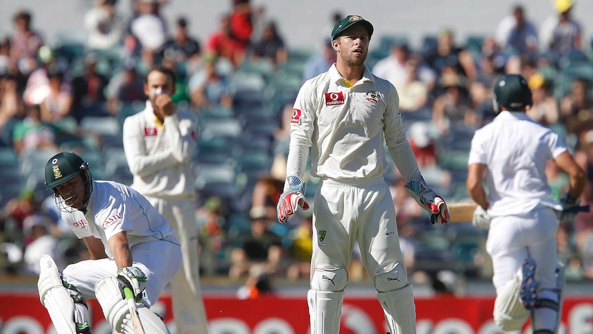 Matthew Wade watches a ball fly away