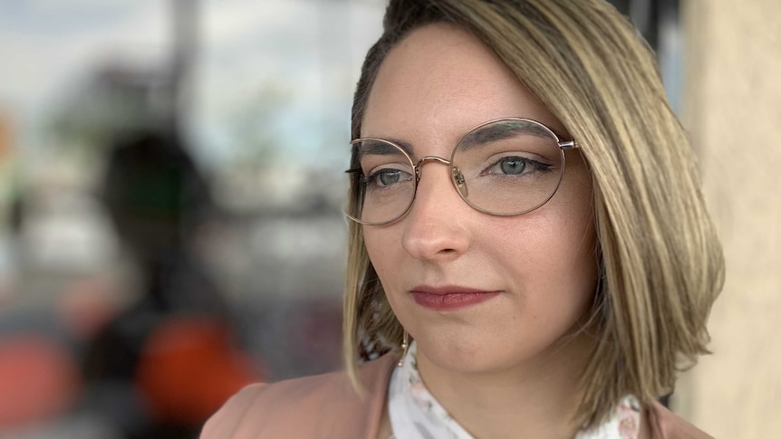 25-year-old retail worker Cassie Marra looking past the camera