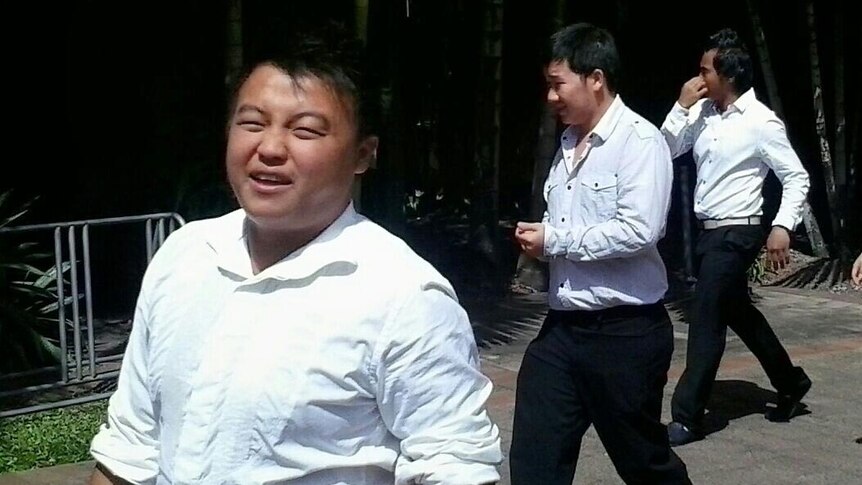 LtoR Tom Chang, 21, Stanley Vang, 23, and Nang Chang, 22, leave Cairns Magistrates Court.