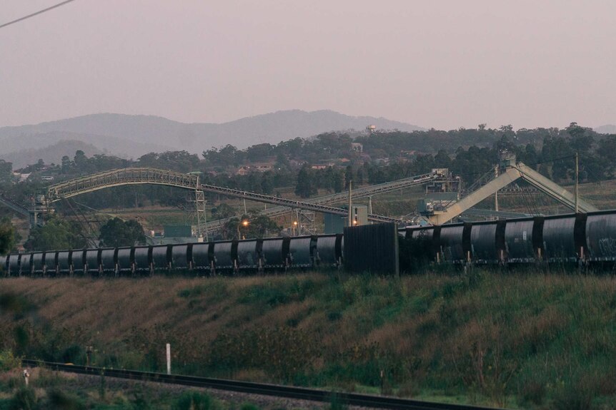 Coal trains and coal mining equipment on a property.