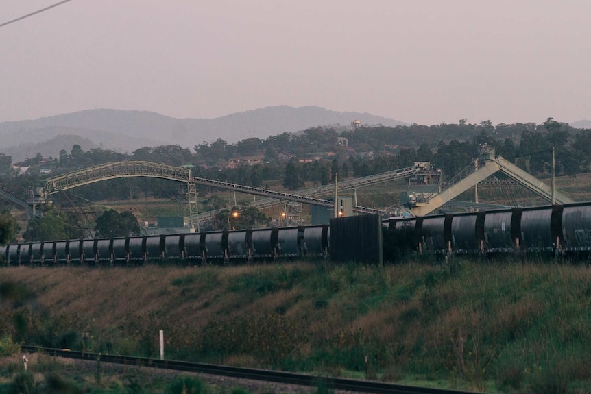 Coal trains and coal mining equipment on a property.