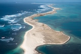 A sandy island surrounded by water