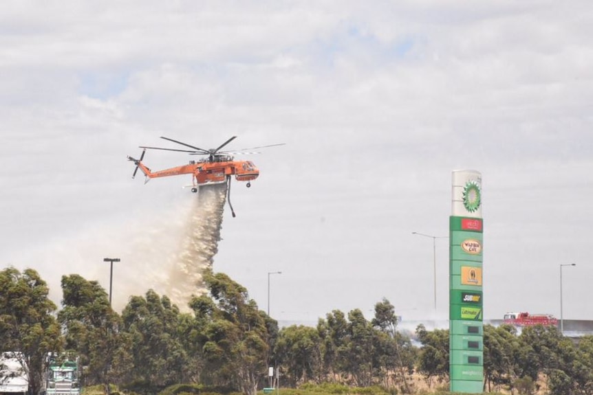 Waterbombers concentrate on dousing fire near Epping petrol station