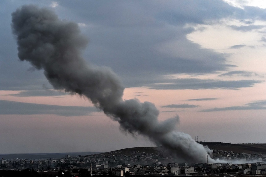 Smoke rises from an explosion in the Syrian town of Kobane after a US-led coalition strike