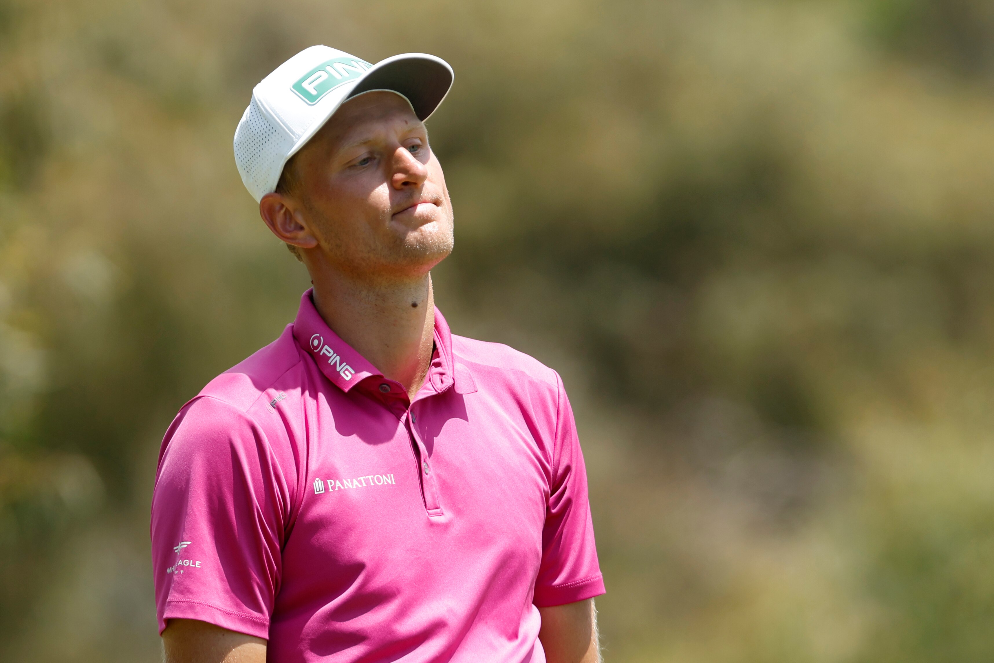 A Polish male golfer stands alone during the Australian Open final round.