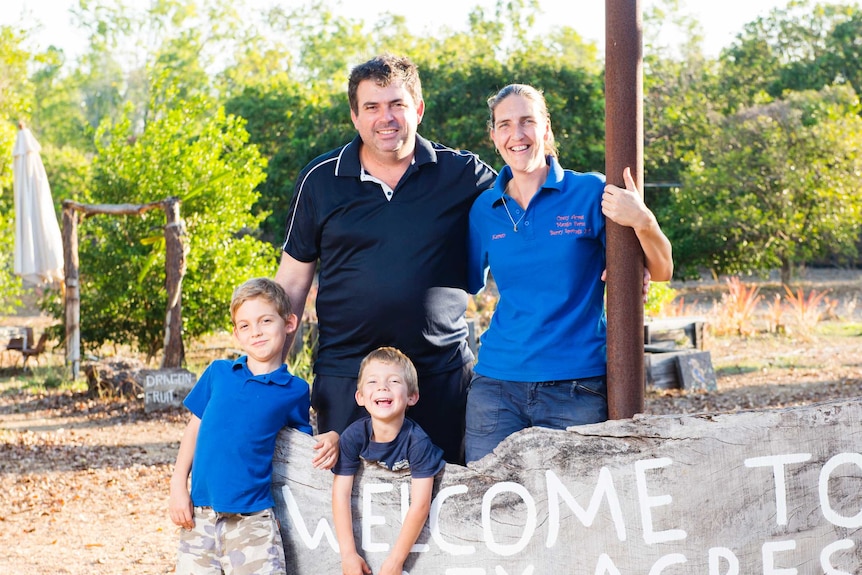 Karen Dean with partner John Churly and their children Jay and Mitchell who own and run a mango farm and cafe in NT.