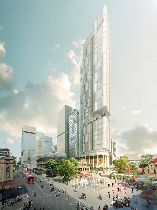 A silver skyscraper towers into the sky over a square with a water feature as crowds of people mill about.