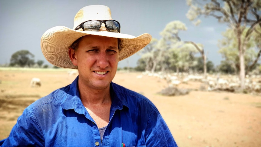 Ben Banks wool producer stands in front of his lambing ewes