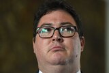 Close up of George Christensen's face, wearing glasses