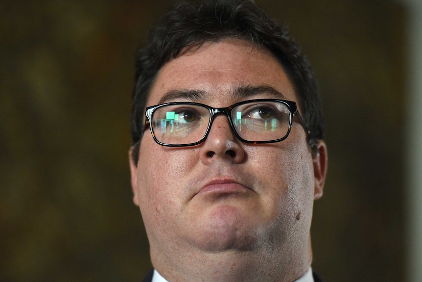 Close up of George Christensen's face, wearing glasses