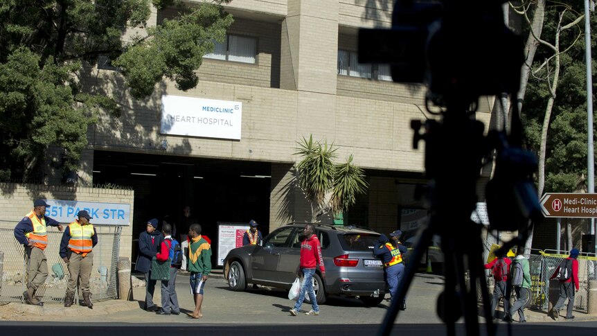 Security and media outside Mandela's hospital