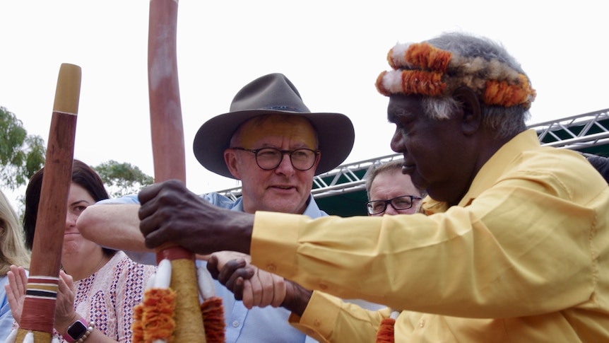 Anthony Albanese shaking hands with Gallarrwuy Yunupingu