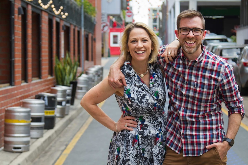 Loretta Ryan and Craig Zonca stand in a Brisbane street.
