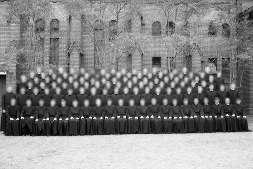 A black-and-white photo of a group of Christian Brothers posed for a photo.