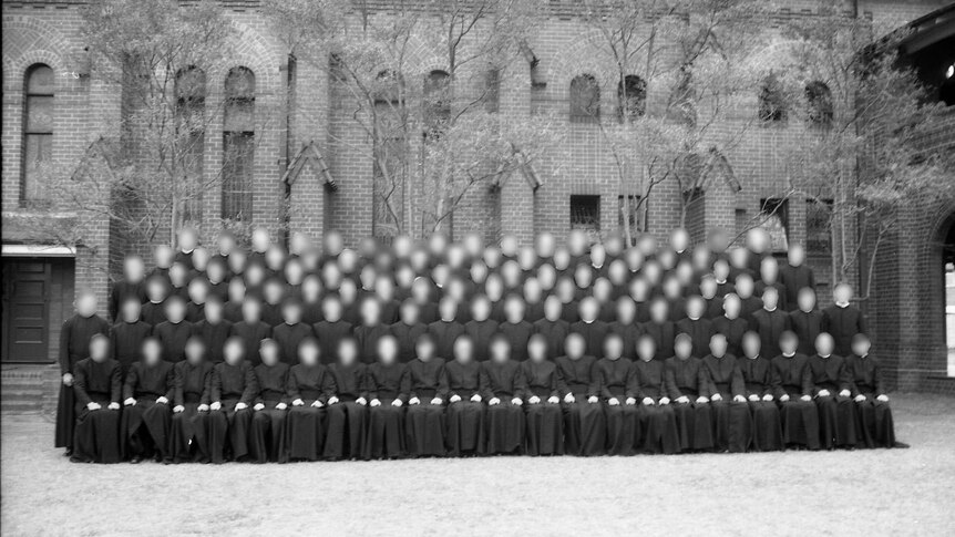 A black-and-white photo of a group of Christian Brothers posed for a photo.