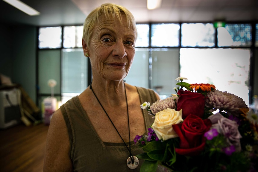 Woman holds flowers