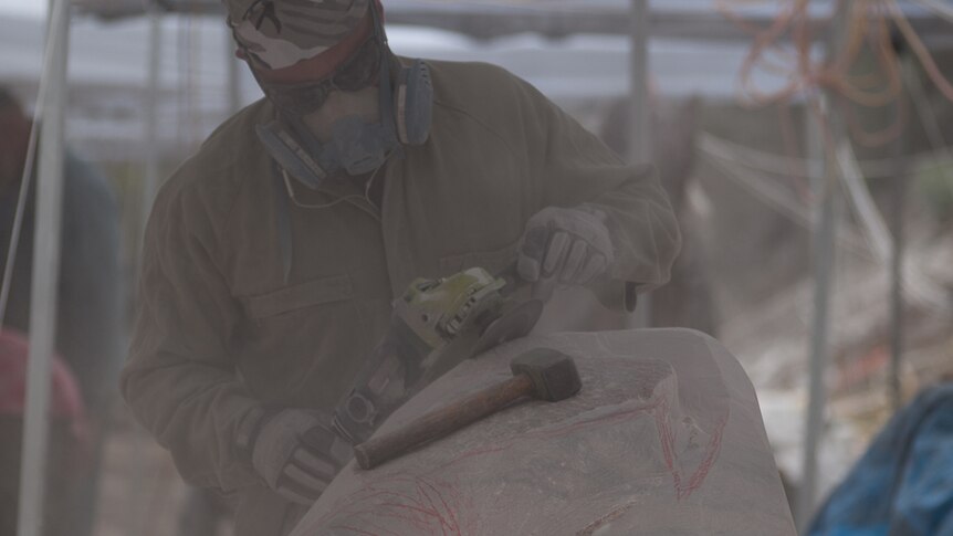 Peter Syndicas of Prospect gets dusty creating his stone artwork.